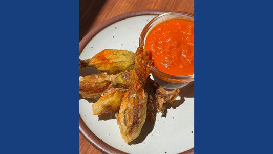 Fried cheesy herby squash blossoms